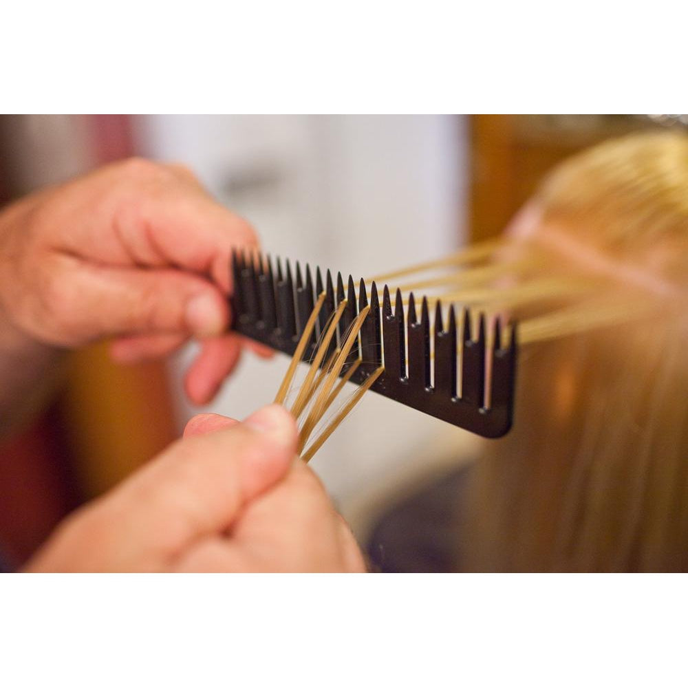 Person demonstrating step #5 in using the Highlighting and foiling comb to easily color hair